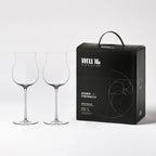 Close-up of hand-blown crystal wine glass showing ultra-thin rim, clear body, and refined stem detail