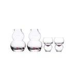Chinese baijiu glass set in soft light with an auspicious gourd silhouette and hand-painted motif