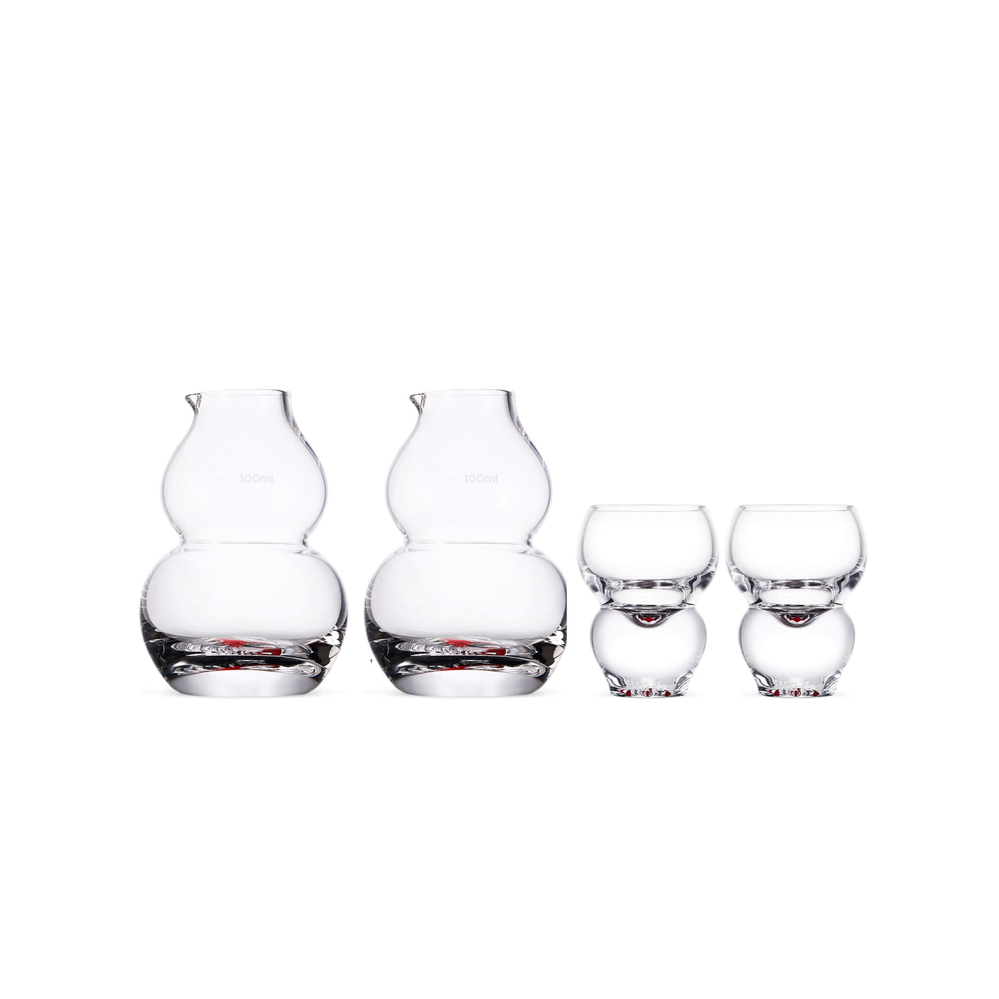 Chinese baijiu glass set in soft light with an auspicious gourd silhouette and hand-painted motif