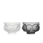 Glaze glass tea cup set in soft light with Year of the Snake relief texture and ebony wood coaster