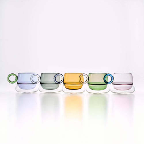 Ciambelle Transparent glass coffee cup in soft light with a rounded sculptural silhouette