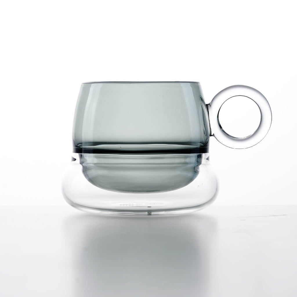 Close-up of Ciambelle Transparent showing clear glass texture, double-layer structure, and refined rim detail