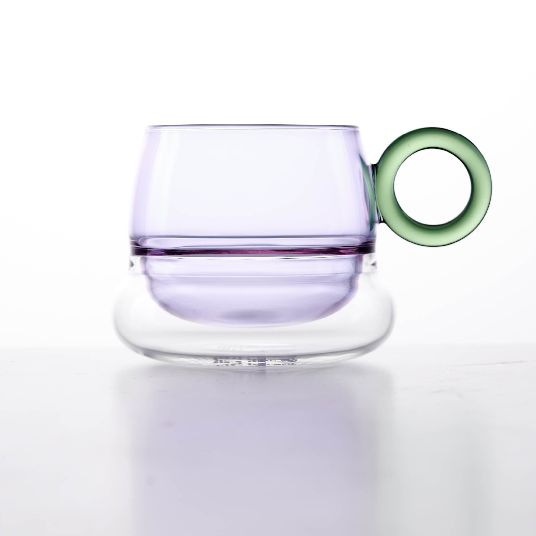 Close-up of Ciambelle Transparent showing clear glass texture, double-layer structure, and refined rim detail