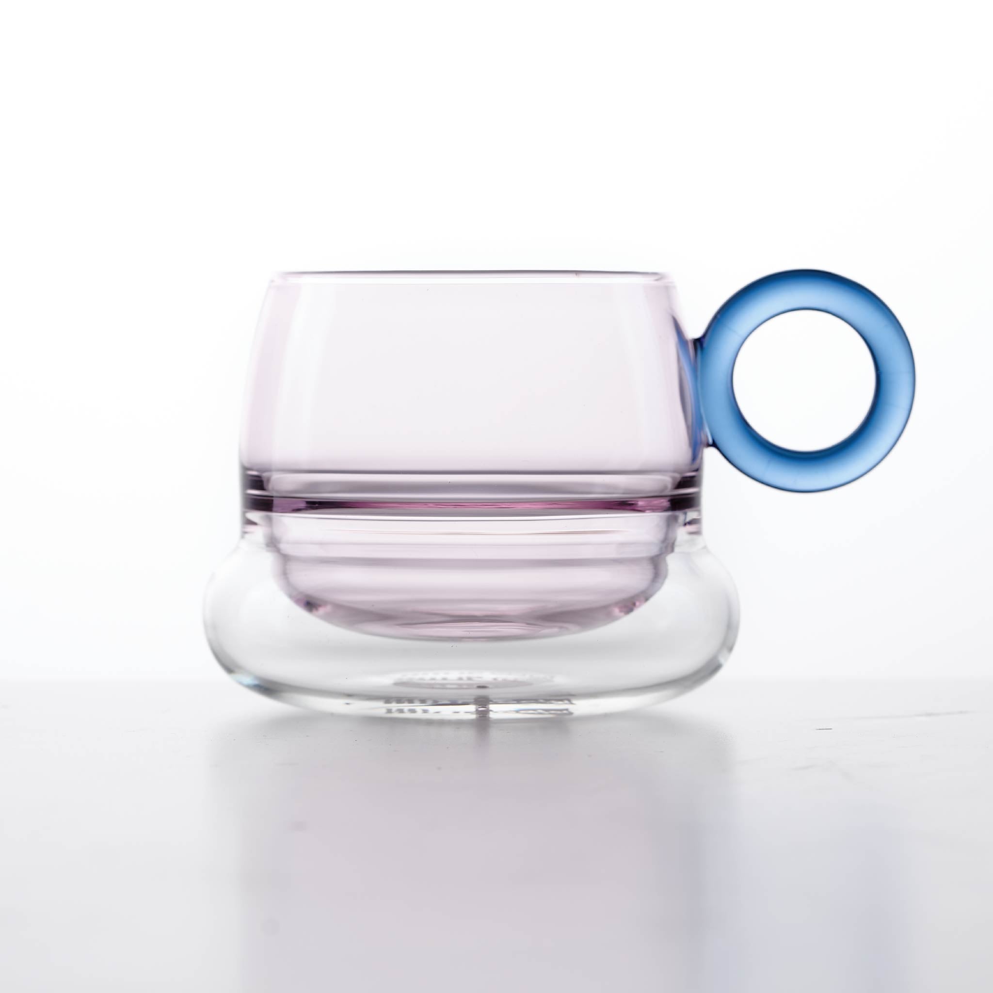 Close-up of Ciambelle Transparent showing clear glass texture, double-layer structure, and refined rim detail