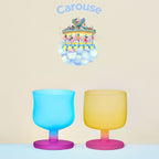 Dolce Amusement Park glass set in soft light with colorful candy-inspired silhouettes