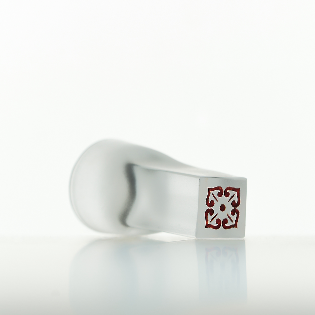 Close-up of crystal Chinese baijiu glass set showing persimmon inspired details and refined craftsmanship