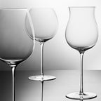 Close-up of hand-blown crystal Chardonnay glass showing ultra-thin rim, clear body, and refined stem detail