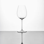 Close-up of hand-blown crystal wine glass showing ultra-thin rim, clear body, and refined stem detail