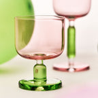 Close-up of the jelly-inspired glass showing transparent color, sculptural body, and thickened base detail