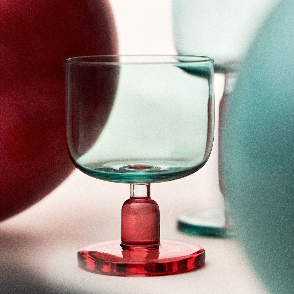 Close-up of the jelly-inspired glass showing transparent color, sculptural body, and thickened base detail