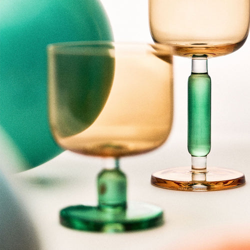 Close-up of the jelly-inspired glass showing transparent color, sculptural body, and thickened base detail