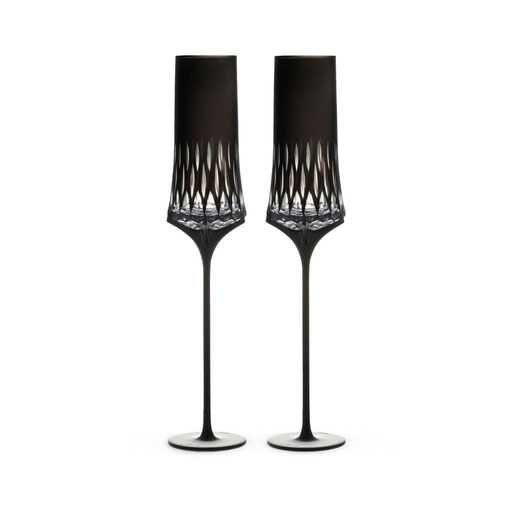 Love Aphrodite Champagne Glass Set in soft light with a tall sculptural silhouette and luminous faceted bowl