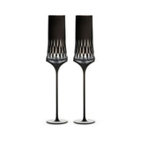 Love Aphrodite Champagne Glass Set in soft light with a tall sculptural silhouette and luminous faceted bowl