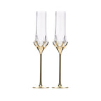 Love Cupid champagne glass set in soft light with a tall sculptural silhouette and sparkling romantic detail
