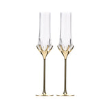 Love Cupid champagne glass set in soft light with a tall sculptural silhouette and sparkling romantic detail