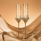 Love Cupid champagne glass set styled for a romantic toast with soft luminous sparkle