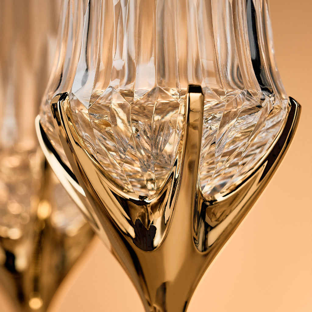 Close-up of Love Cupid champagne glass set showing hand-blown glass, crystal accent, and silver-toned stem detail