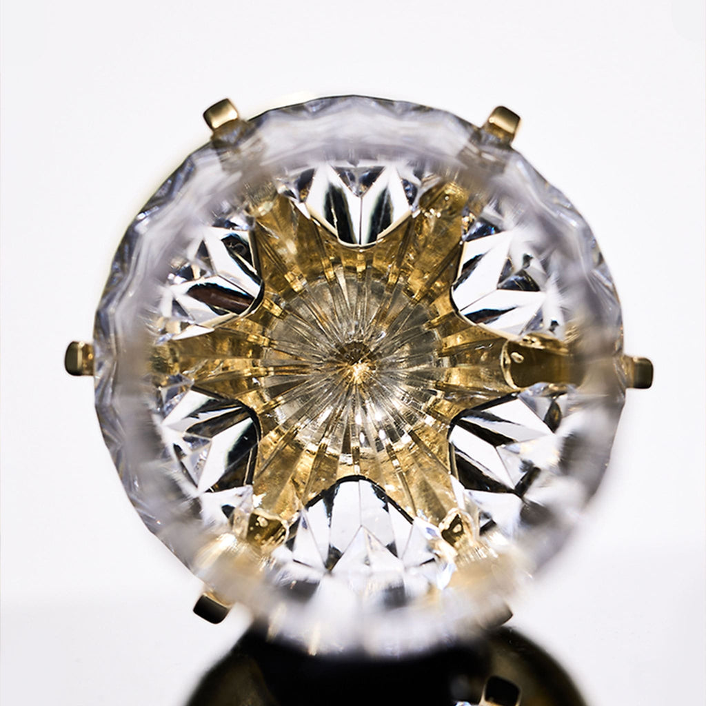 Close-up of Love Cupid champagne glass set showing hand-blown glass, crystal accent, and silver-toned stem detail