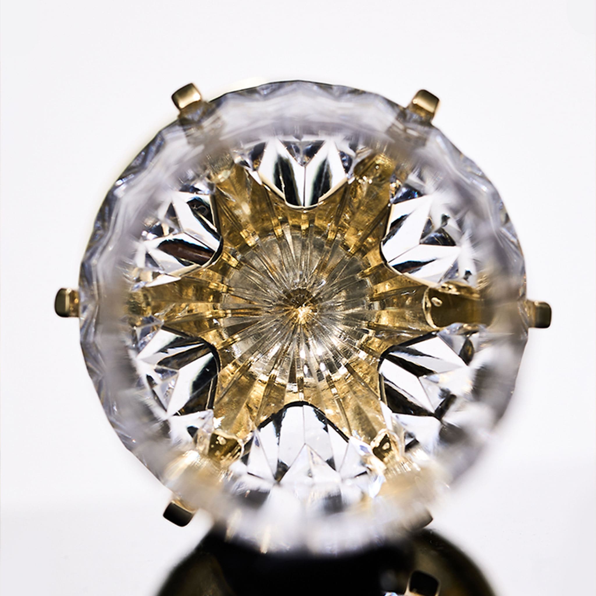 Close-up of Love Cupid champagne glass set showing hand-blown glass, crystal accent, and silver-toned stem detail