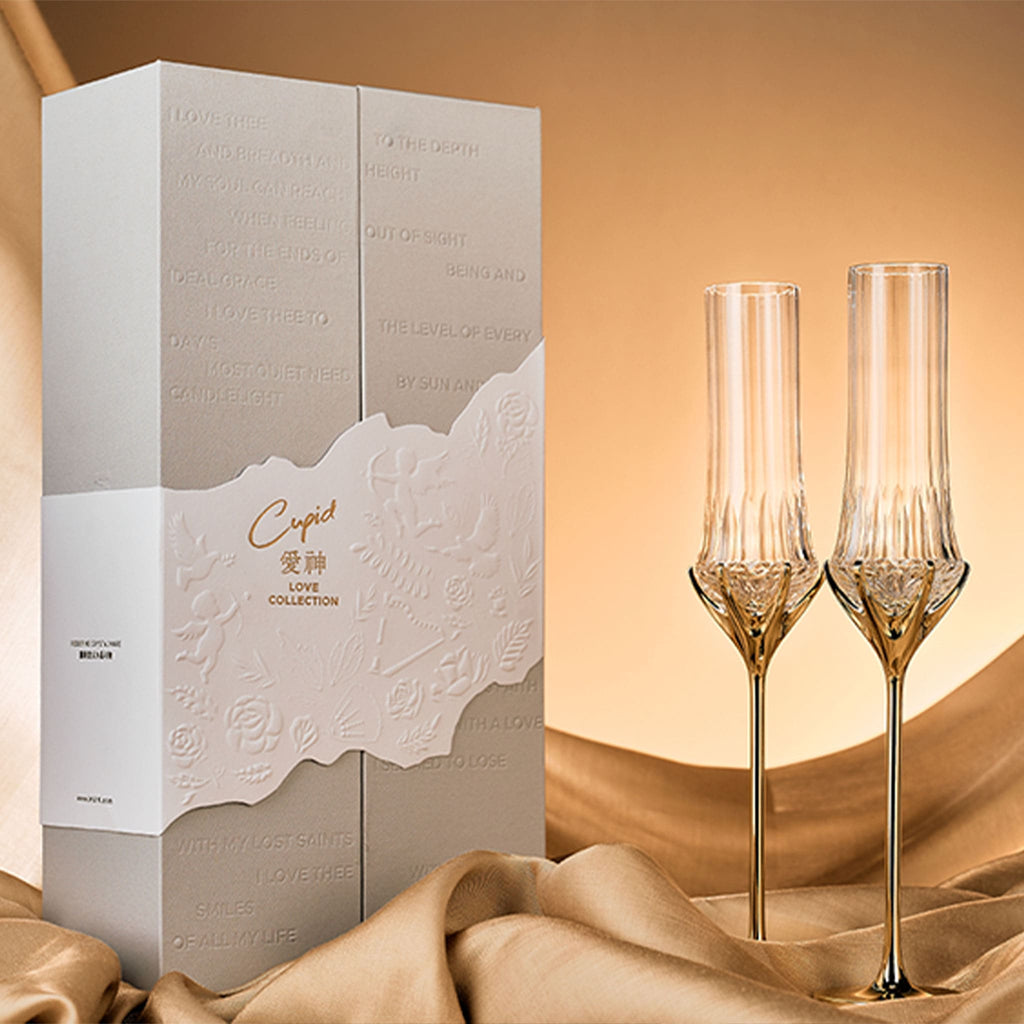 Love Cupid champagne glass set in soft light with a tall sculptural silhouette and sparkling romantic detail