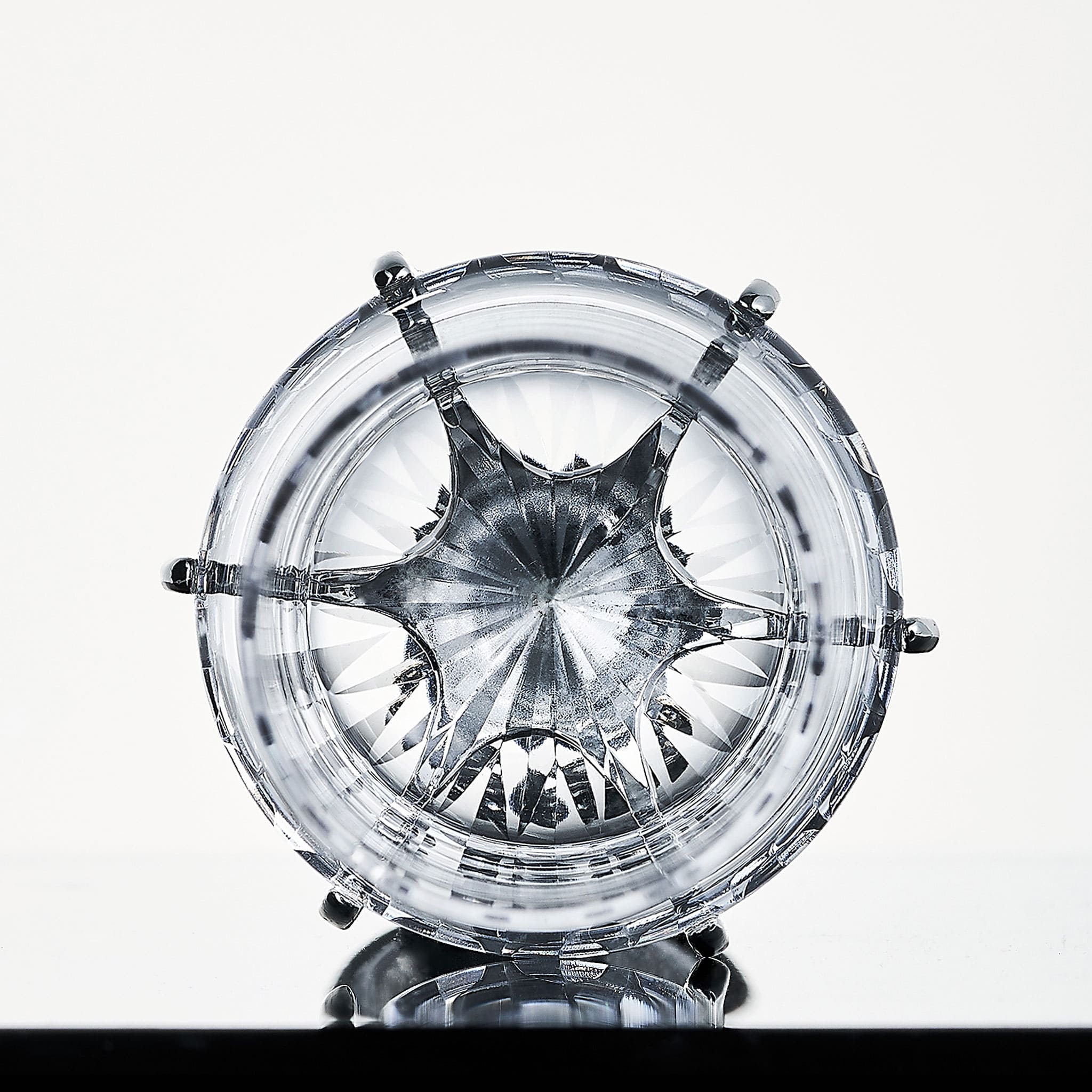Close-up of Love Venus Champagne Glass Set showing hand-cut glass texture, six-claw setting, and silver-plated stem detail