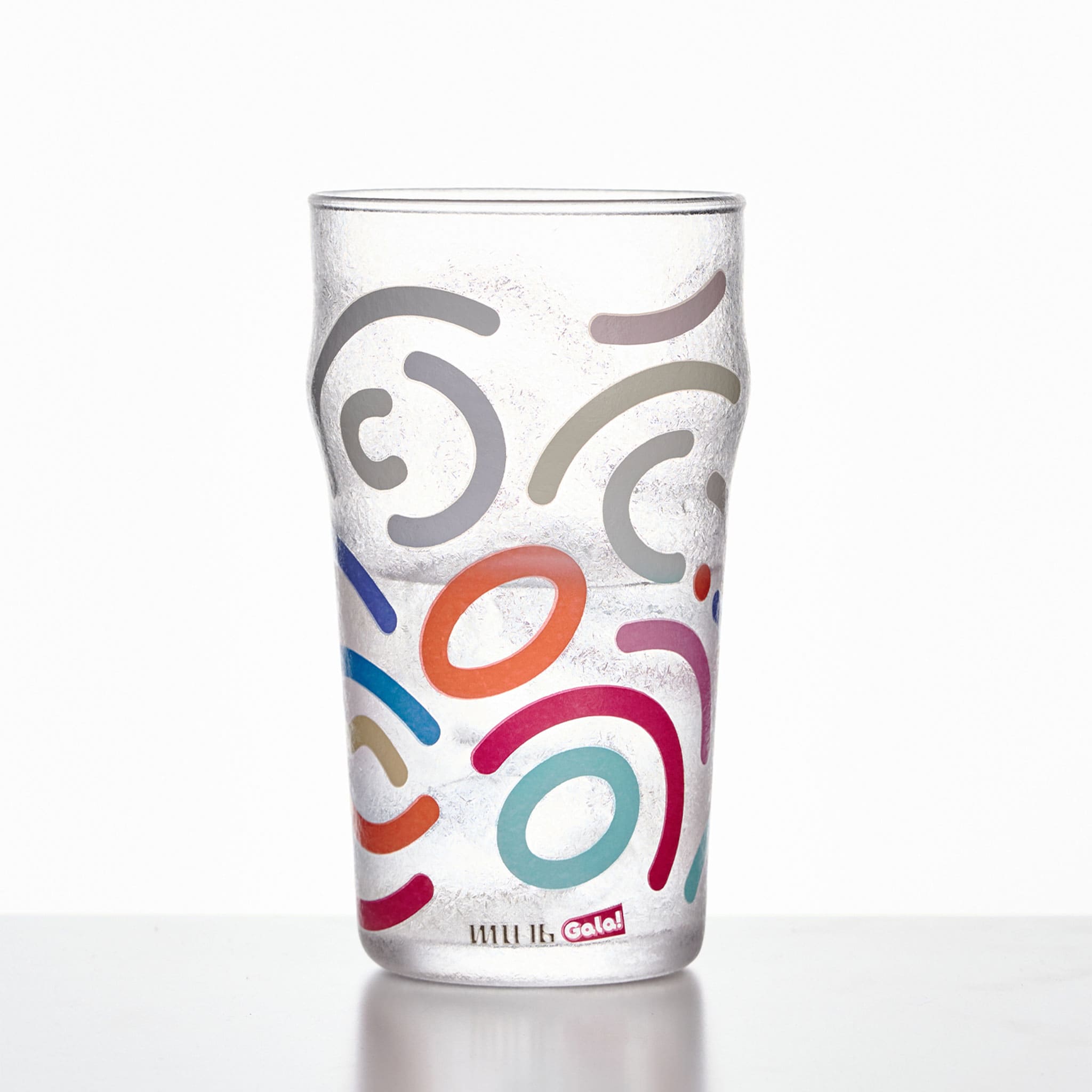 Memphis Milano beer glass in soft light with bold graphic detail and a tall sculptural silhouette