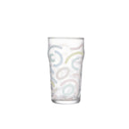 Memphis Milano beer glass in soft light with bold graphic detail and a tall sculptural silhouette