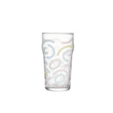 Memphis Milano beer glass in soft light with bold graphic detail and a tall sculptural silhouette