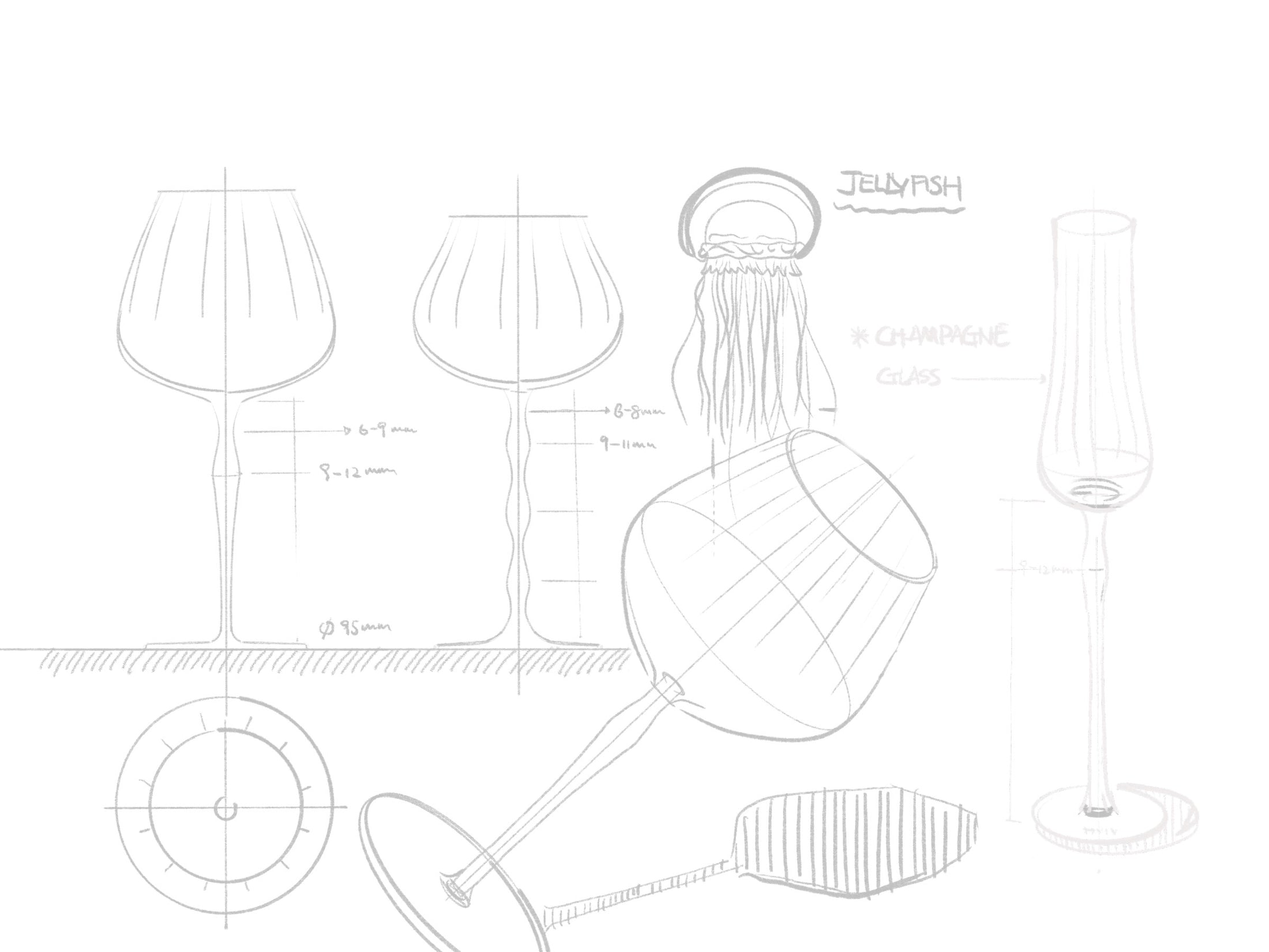 Close-up of crystal wine glasses showing ribbed bowl texture, curved stems, and moon jellyfish-inspired color contrast