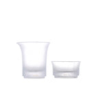 Two white glass containers on a white background