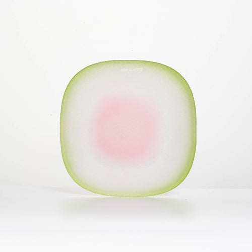 Close-up of Nubi Dessert plate showing matte texture, irregular base pattern, and softly blended color detail