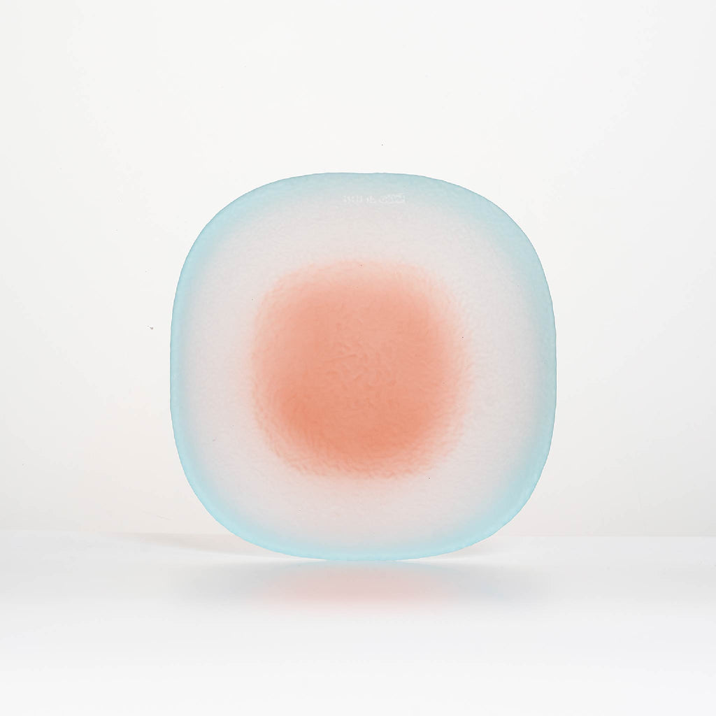 Close-up of Nubi Dessert plate showing matte texture, irregular base pattern, and softly blended color detail