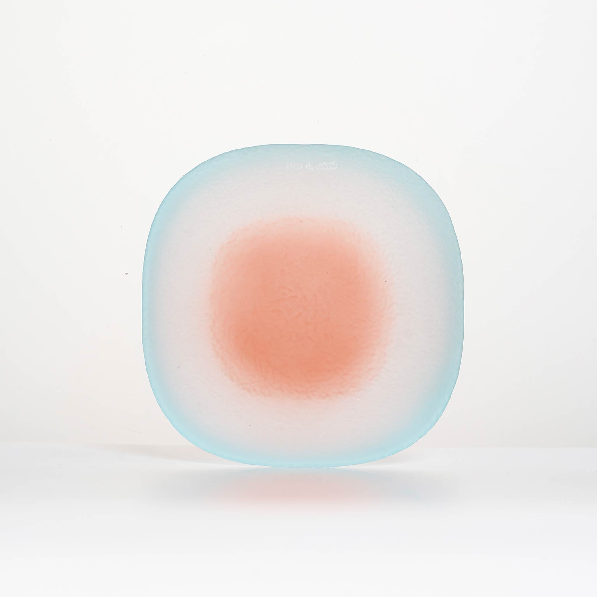 Close-up of Nubi Dessert plate showing matte texture, irregular base pattern, and softly blended color detail