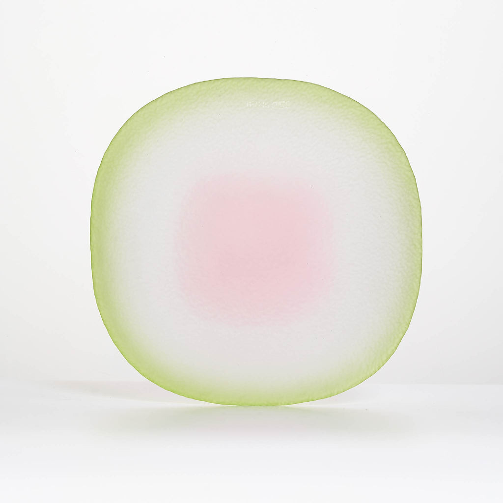 Close-up of Nubi Dinner plate showing matte texture, irregular base pattern, and softly blended color detail