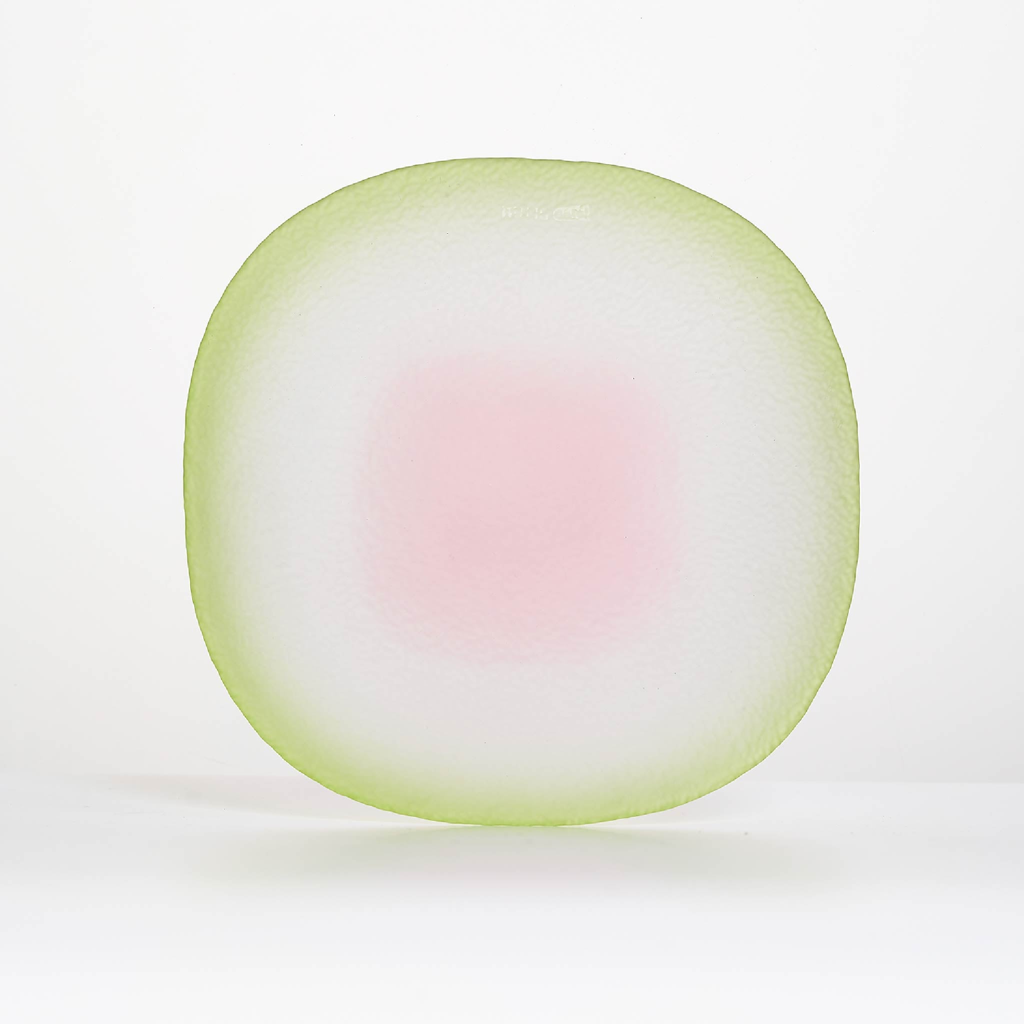 Close-up of Nubi Dinner plate showing matte texture, irregular base pattern, and softly blended color detail