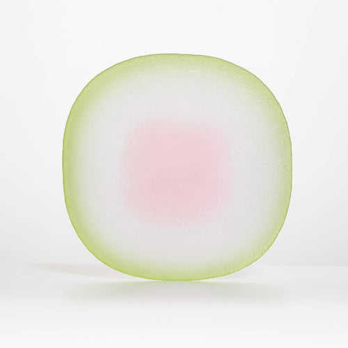 Close-up of Nubi Dinner plate showing matte texture, irregular base pattern, and softly blended color detail