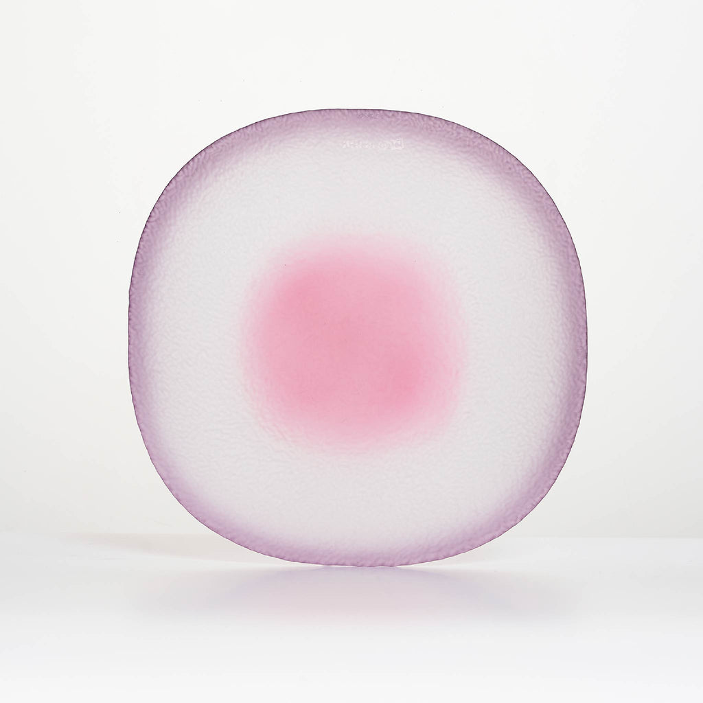 Close-up of Nubi Dinner plate showing matte texture, irregular base pattern, and softly blended color detail