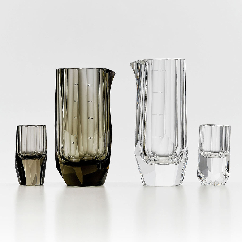 Crystal baijiu glass in soft light with raw diamond-inspired facets and brilliant reflective detail