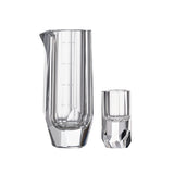 Crystal baijiu glass in soft light with raw diamond-inspired facets and brilliant reflective detail