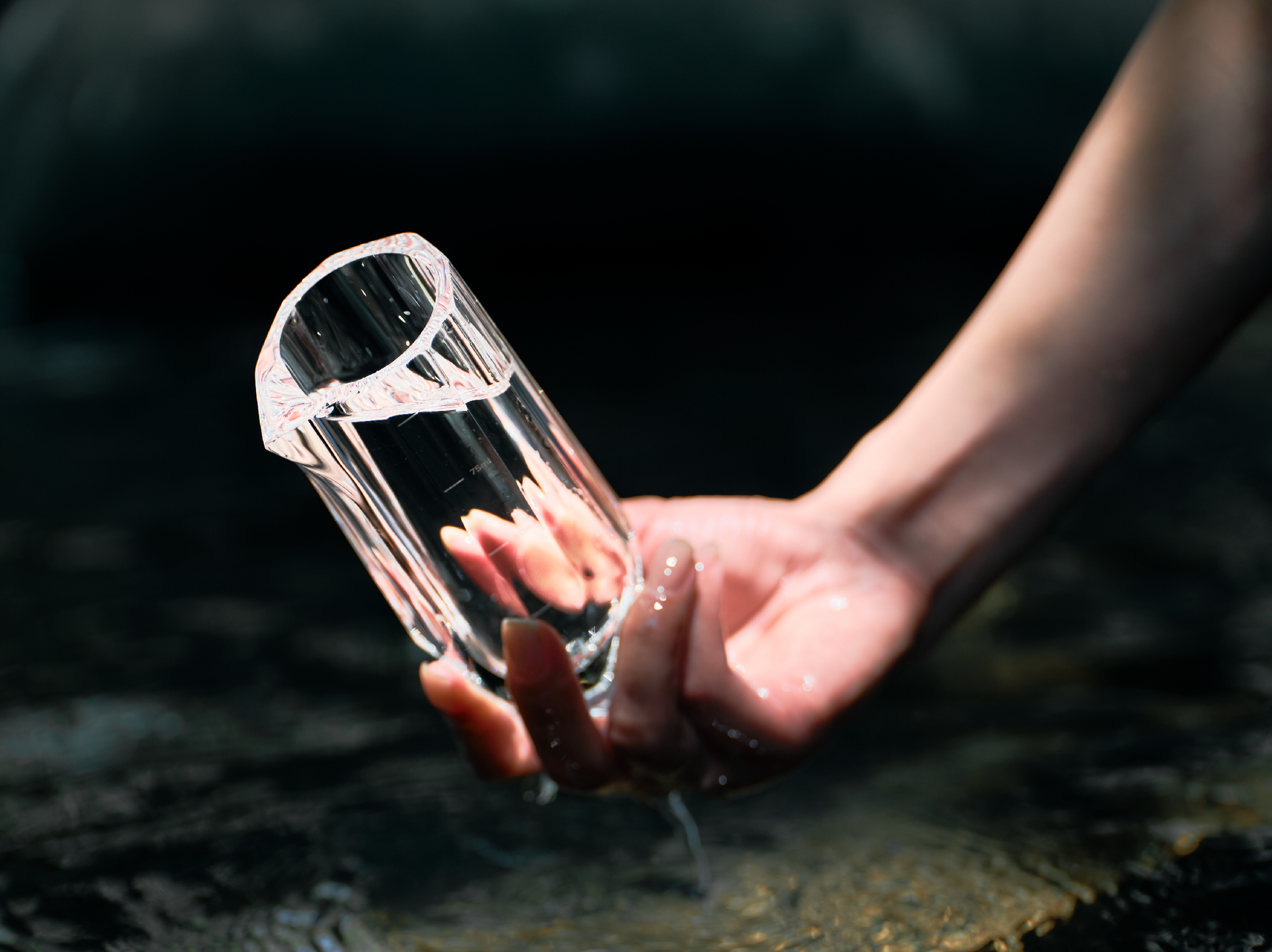 Crystal baijiu glass styled for a quiet drinking ritual with bright reflections and a weighted base