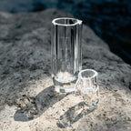 Crystal baijiu glass styled for a quiet drinking ritual with bright reflections and a weighted base