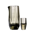 Crystal baijiu glass in soft light with raw diamond-inspired facets and brilliant reflective detail