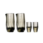 Crystal baijiu glass in soft light with raw diamond-inspired facets and brilliant reflective detail