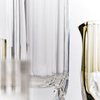 Close-up of crystal baijiu glass showing gemstone-like facets, polished edges, and thick weighted base