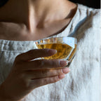 Raw Cullinan tea cup styled for a quiet tea ritual with bright reflections and a weighted form