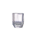 Raw Enigma whiskey glass in soft light with raw diamond-inspired facets and brilliant reflective detail