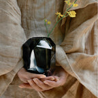 Raw Enigma Crystal vase styled for a quiet interior ritual with bright reflections and a weighted form