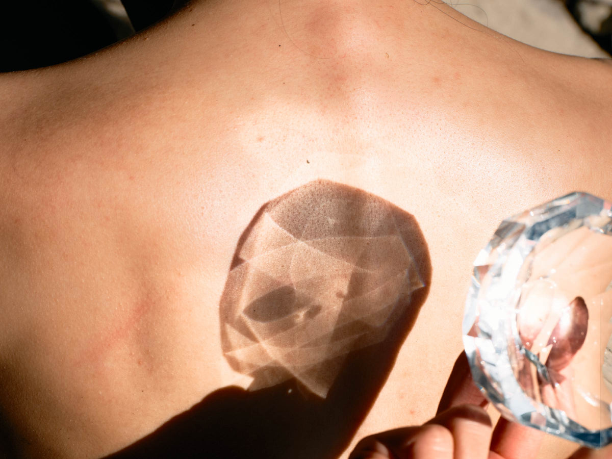 Close-up of crystal vase showing gemstone-like facets, polished edges, and weighted crystal detail