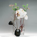 Raw Enigma Crystal vase styled for a quiet interior ritual with bright reflections and a weighted form