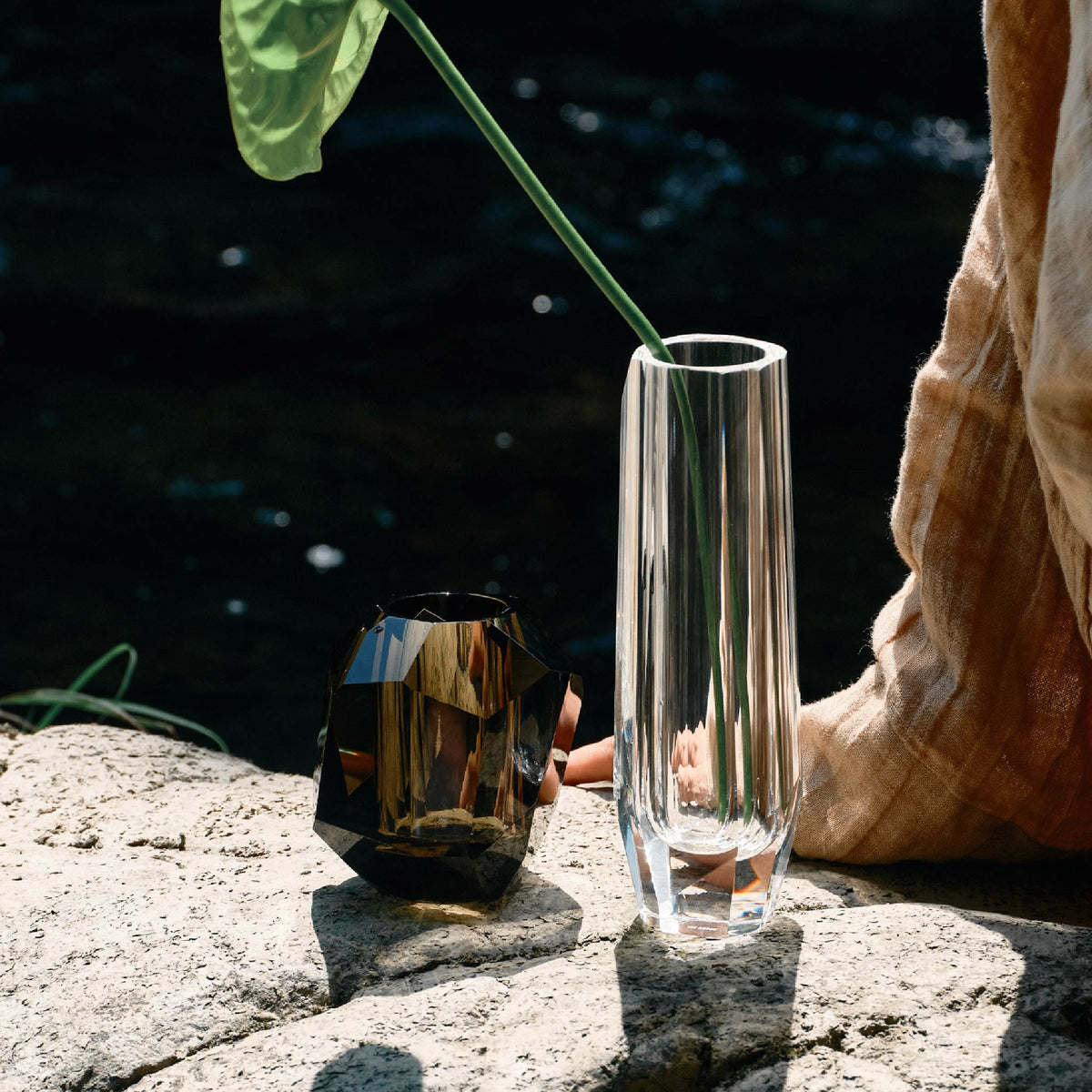 Raw Enigma Crystal vase styled for a quiet interior ritual with bright reflections and a weighted form
